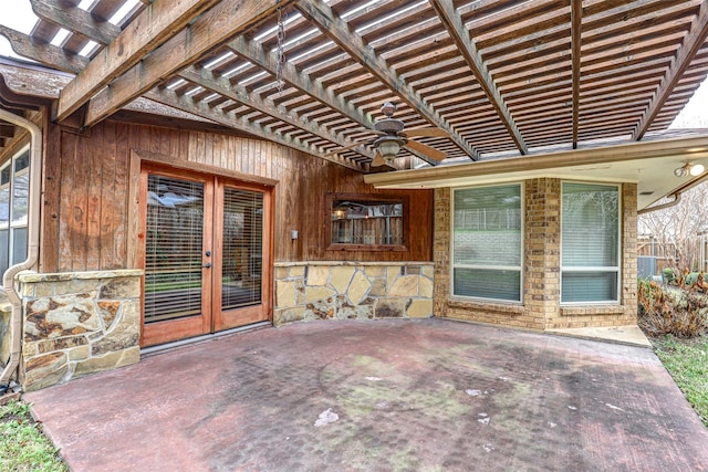 view of patio / terrace featuring french doors, ceiling fan, and a pergola