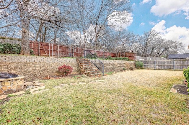 view of yard featuring a fire pit