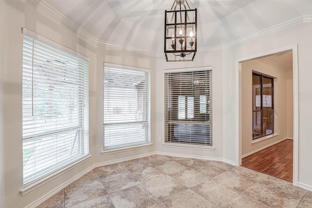 unfurnished dining area featuring ornamental molding and an inviting chandelier