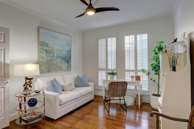 living room featuring ornamental molding, hardwood / wood-style floors, and ceiling fan