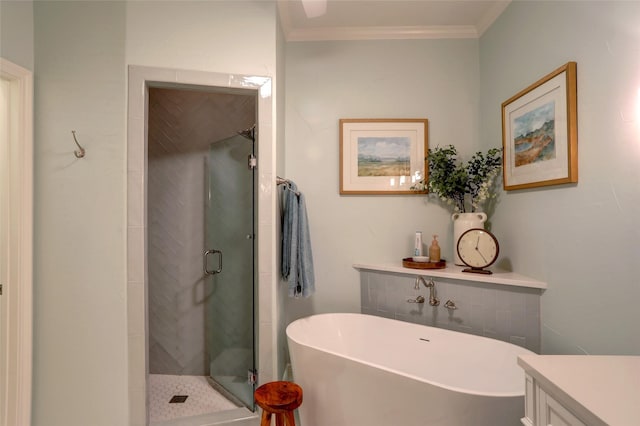 bathroom featuring vanity, crown molding, and independent shower and bath