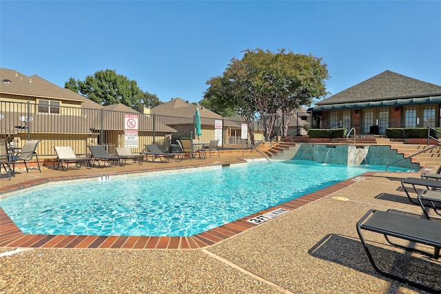 view of swimming pool with a patio