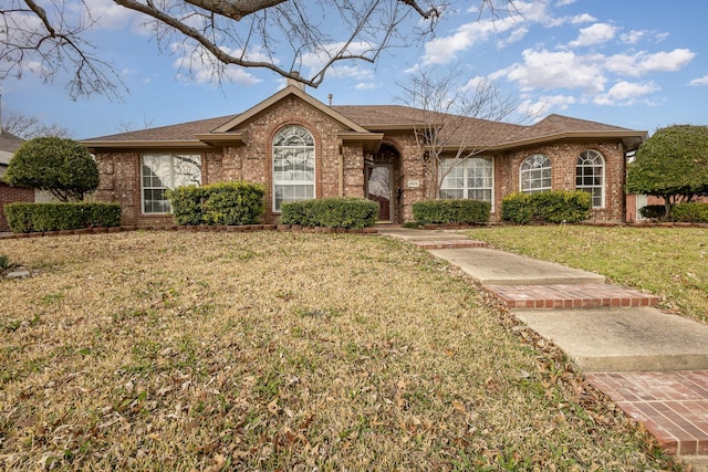 ranch-style home with a front yard