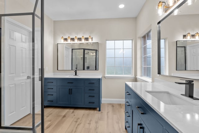 bathroom featuring vanity and wood-type flooring