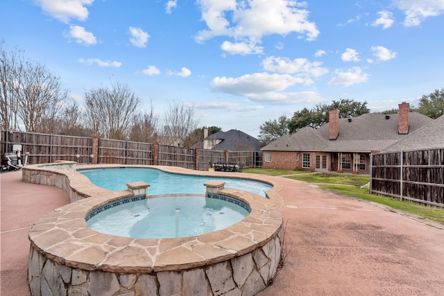 view of swimming pool featuring an in ground hot tub and a patio area