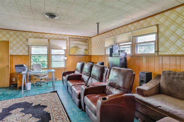 home theater room featuring crown molding