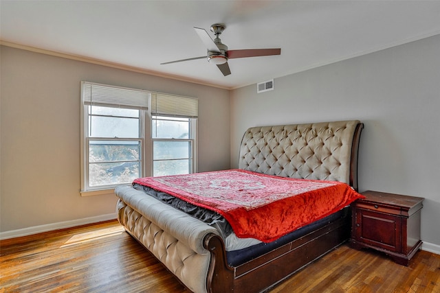 bedroom featuring crown molding, ceiling fan, and hardwood / wood-style floors