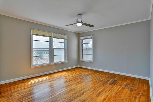 empty room featuring ornamental molding, ceiling fan, and light hardwood / wood-style floors