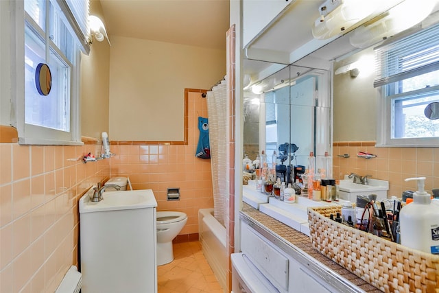 full bathroom with toilet, sink, tile walls, shower / bath combo with shower curtain, and tile patterned flooring