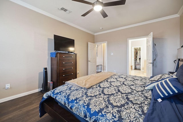 bedroom with crown molding, ceiling fan, and dark hardwood / wood-style flooring