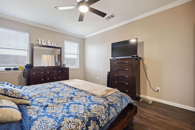 bedroom featuring dark wood-type flooring, ceiling fan, and crown molding