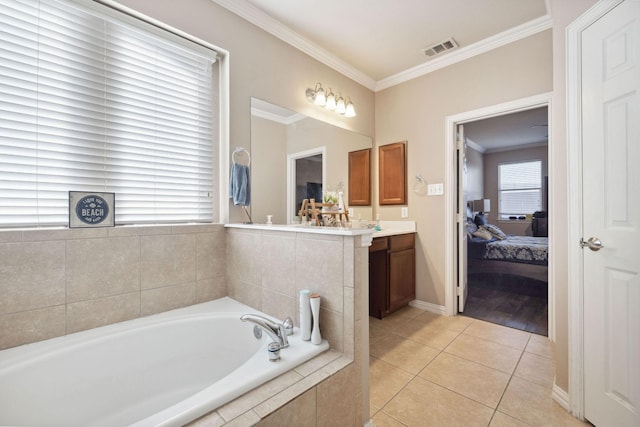 bathroom with vanity, tile patterned flooring, ornamental molding, and a relaxing tiled tub