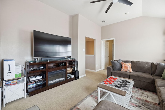 carpeted living room featuring ceiling fan and vaulted ceiling