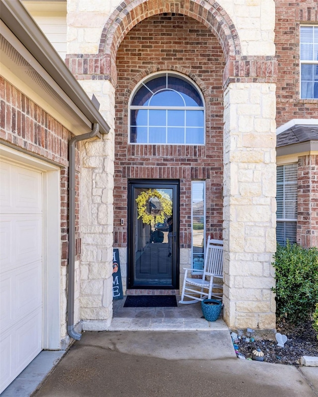 doorway to property featuring a garage