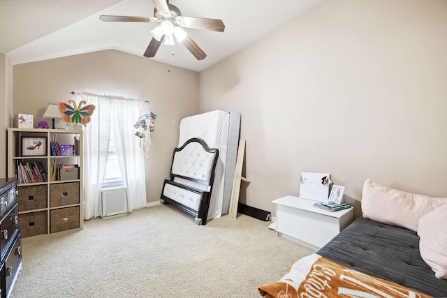 living area with lofted ceiling, light colored carpet, and ceiling fan