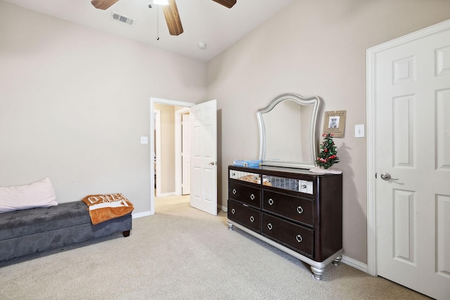 living area with light colored carpet and ceiling fan