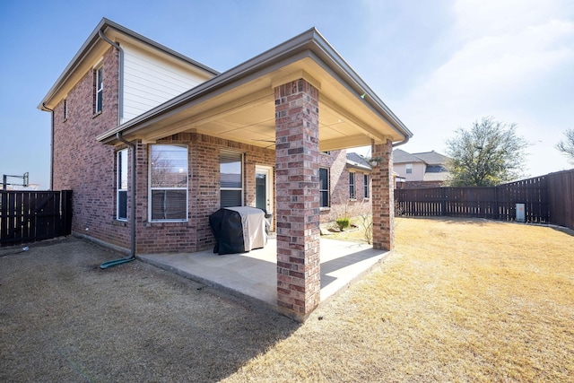 back of property with a patio