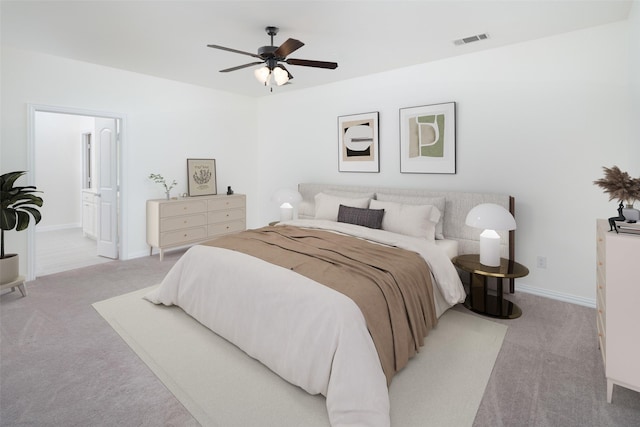 bedroom featuring ceiling fan, ensuite bathroom, and light carpet