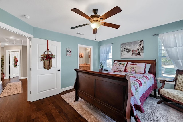 bedroom with ceiling fan, connected bathroom, and dark hardwood / wood-style flooring