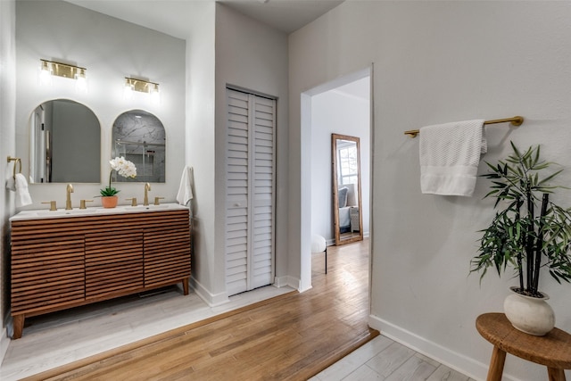 bathroom featuring vanity and hardwood / wood-style floors