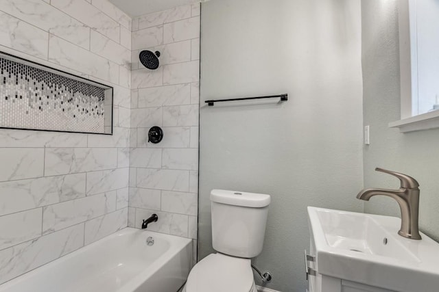 full bathroom featuring vanity, toilet, and tiled shower / bath