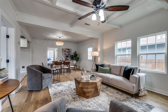 living room featuring crown molding, beam ceiling, light hardwood / wood-style floors, and ceiling fan