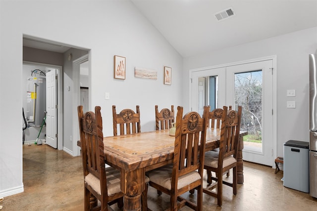 dining room featuring french doors and lofted ceiling