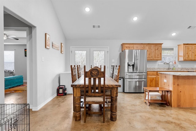 dining room featuring lofted ceiling, sink, ceiling fan, and french doors