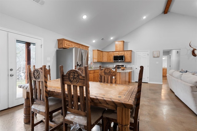 dining space featuring french doors, concrete flooring, high vaulted ceiling, and beam ceiling