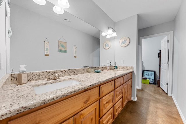 bathroom featuring vanity and concrete floors