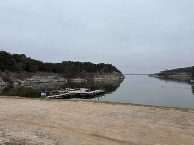 property view of water featuring a boat dock