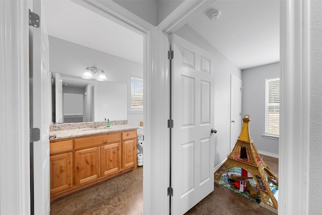 bathroom featuring vanity and concrete flooring