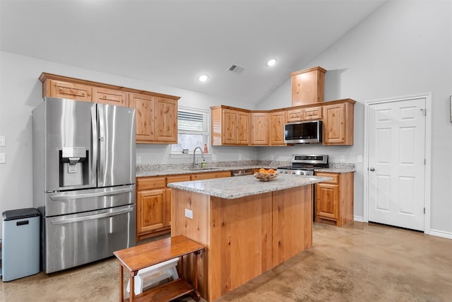 kitchen featuring sink, appliances with stainless steel finishes, high vaulted ceiling, light stone counters, and a kitchen island