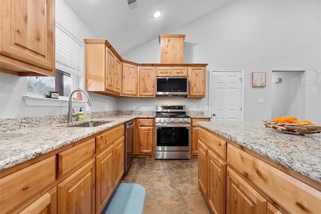 kitchen with stainless steel appliances, concrete flooring, light stone countertops, and sink