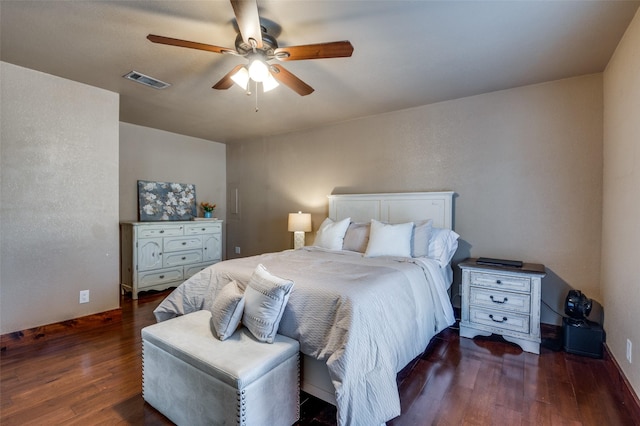 bedroom with dark wood-type flooring and ceiling fan