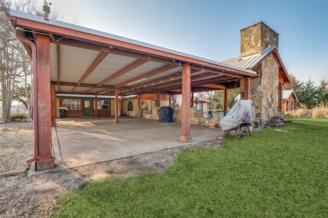 view of patio featuring an outbuilding and area for grilling