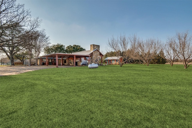 view of yard featuring a carport