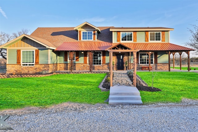 view of front facade featuring a front lawn and a porch