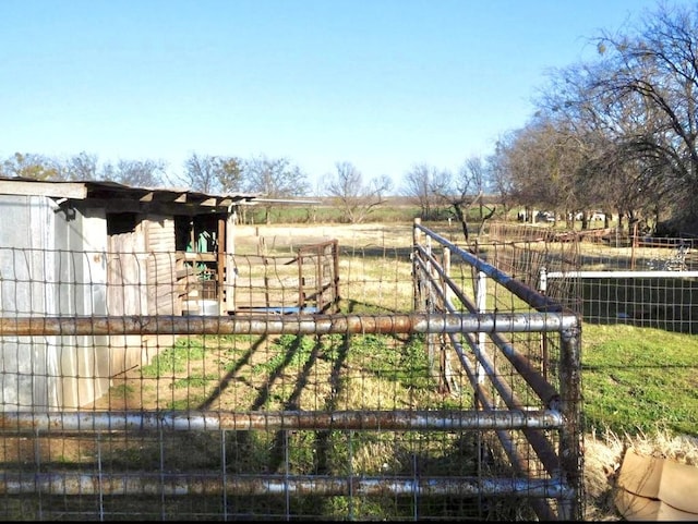 view of gate featuring fence