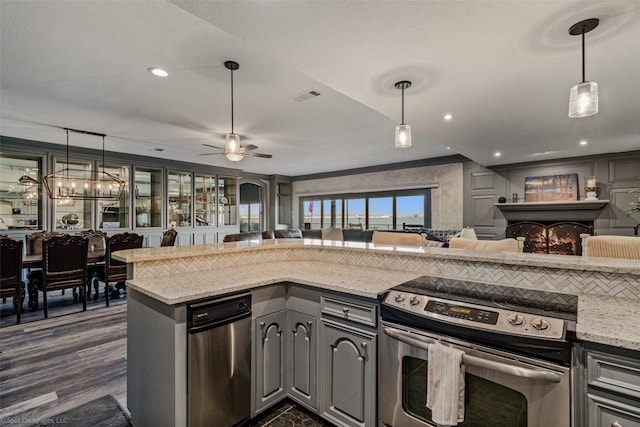 kitchen with stainless steel electric stove, a ceiling fan, visible vents, open floor plan, and gray cabinetry