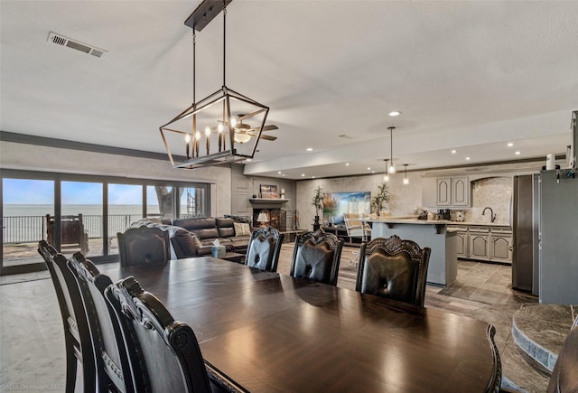 dining area with recessed lighting, a notable chandelier, and visible vents
