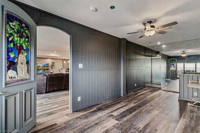 empty room featuring wood finished floors and ceiling fan
