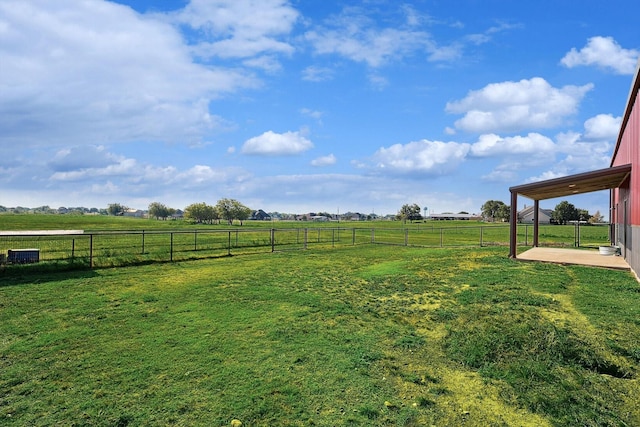 view of yard with a patio area and a rural view