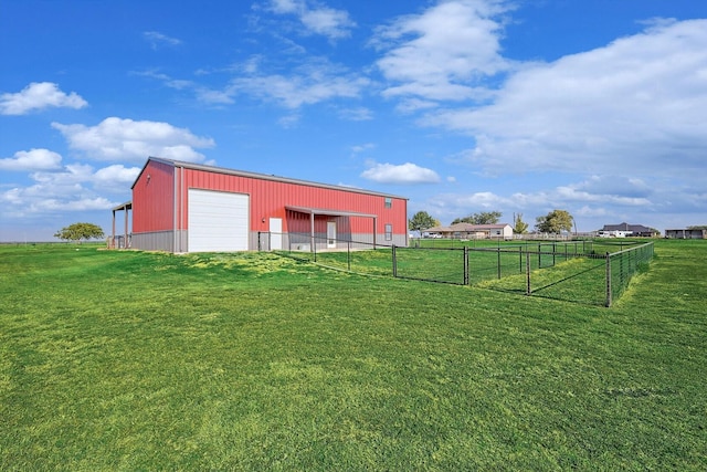 view of outbuilding featuring a garage and a lawn