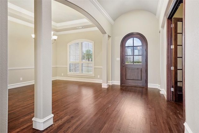 entryway with ornamental molding, vaulted ceiling, and dark wood-type flooring