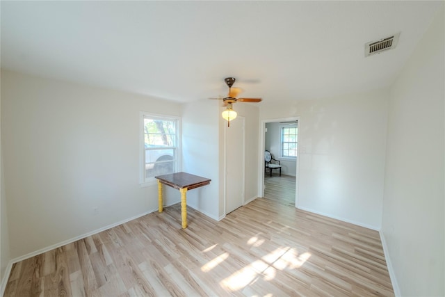 empty room featuring light hardwood / wood-style flooring and ceiling fan