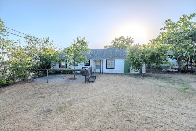 back of house featuring a yard and a patio