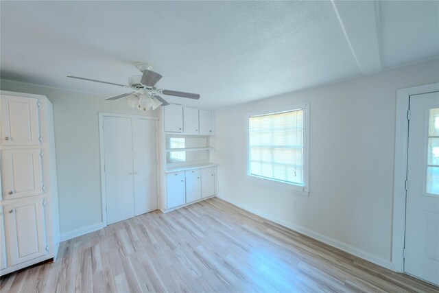 interior space with ceiling fan and light wood-type flooring