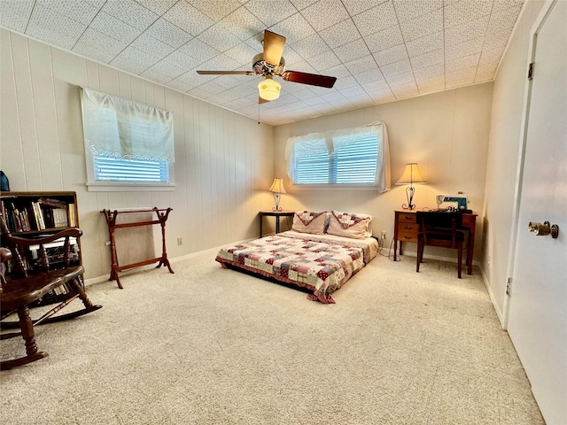 bedroom with ceiling fan and carpet floors