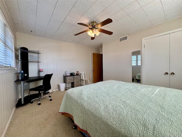 carpeted bedroom with ceiling fan